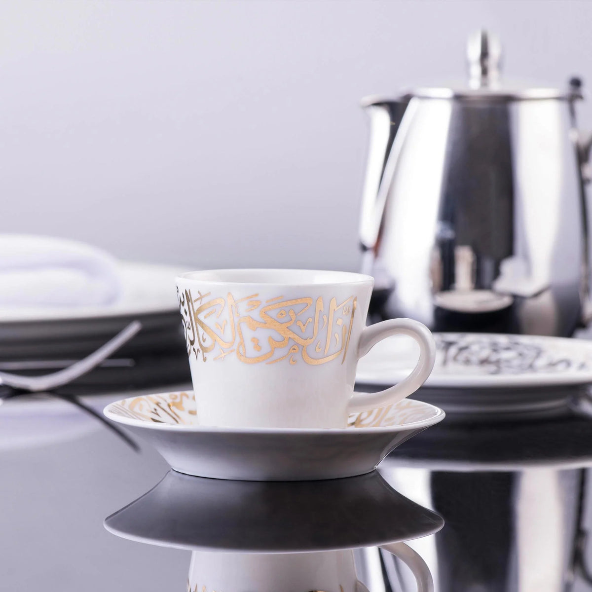 Dimlaj Kareem coffee cups and saucers in gold-gilded porcelain, set of six, detail view