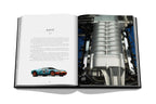 Open book showing a detailed image of a car engine and a Ford GT illustration on a white background.