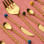 Bitossi Home Torchon gold salad serving set with twisted handles, 31cm, styled in a table setting (2)